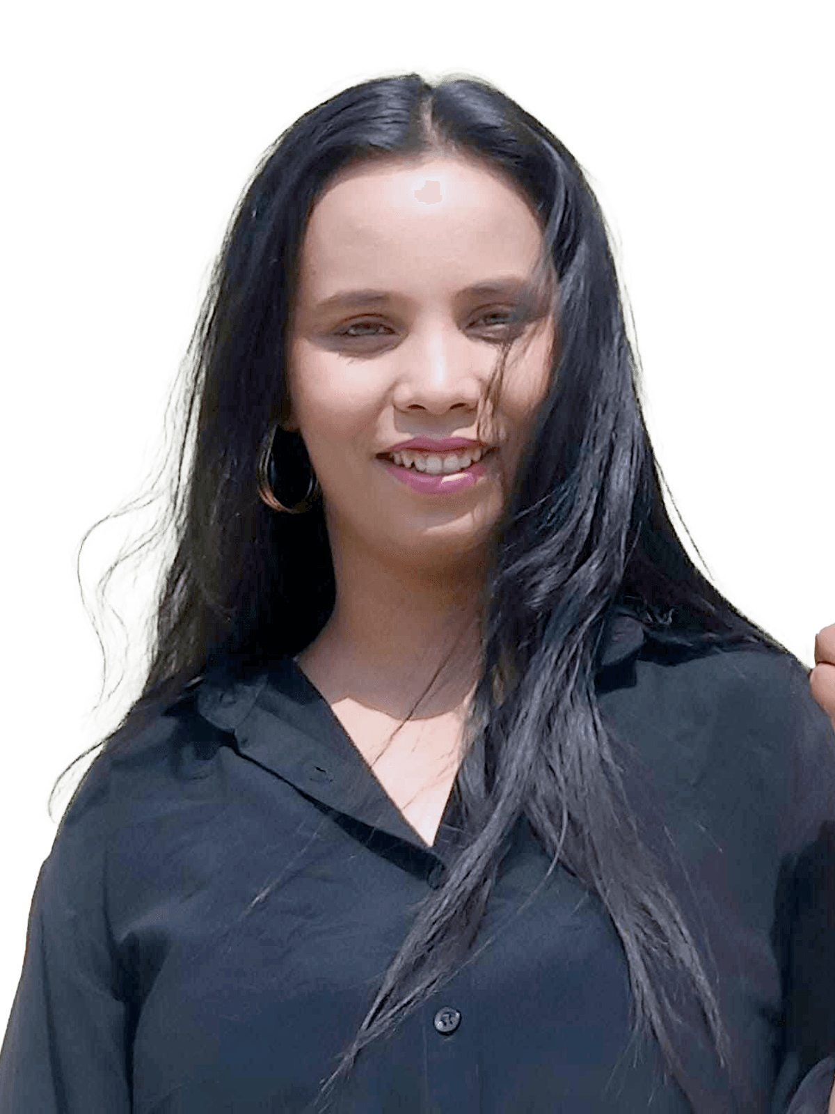 Portrait of Garima Dev standing against a neutral background in a black blazer.